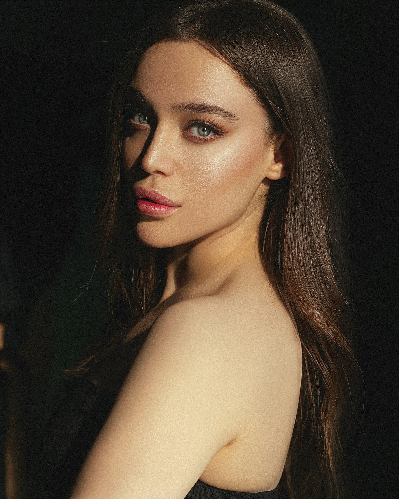 Editorial portrait against a dark field